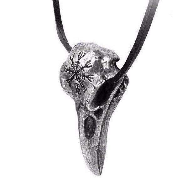 Silver bird skull pendant on a black cord against a white background