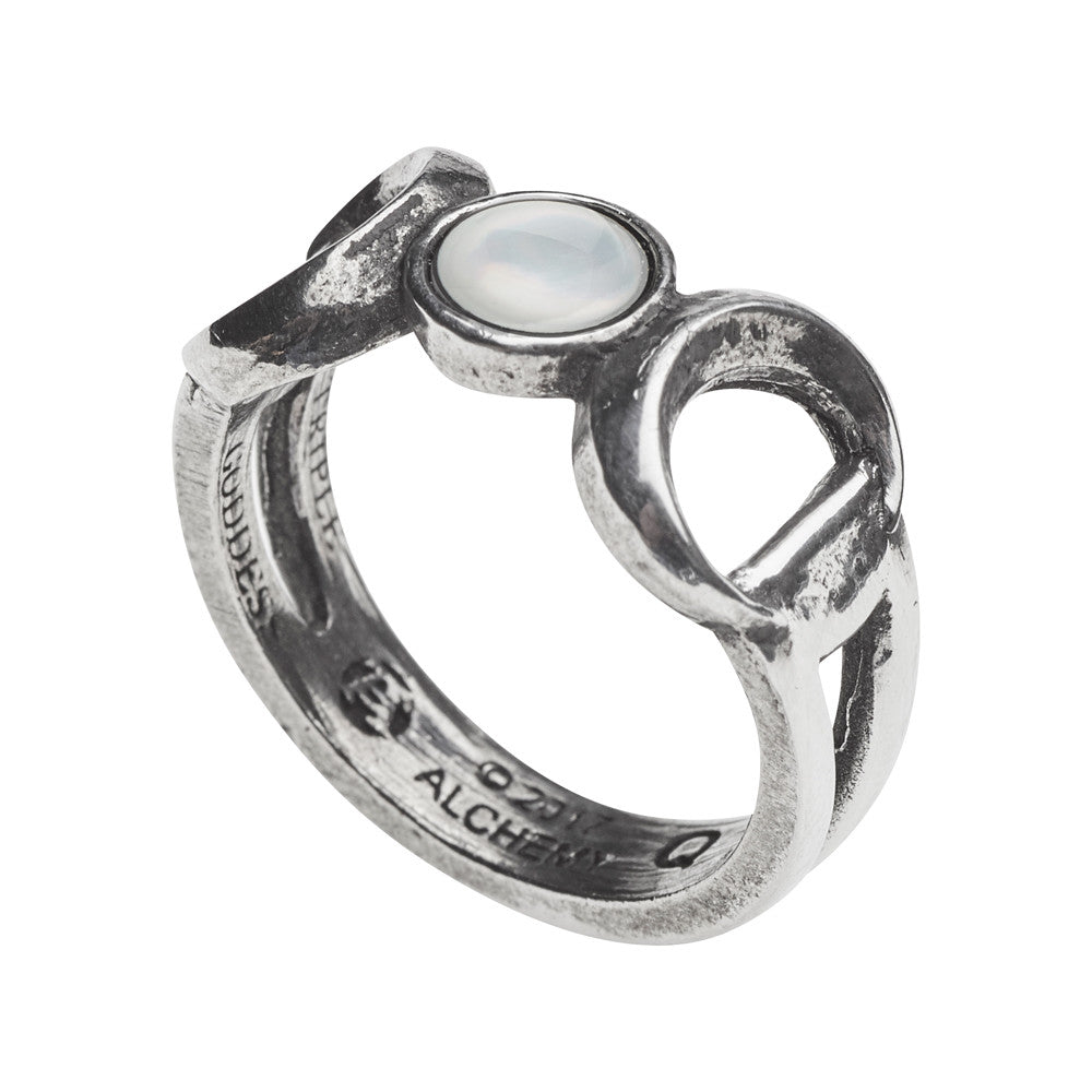 Silver ring with a circular design and central gemstone on a white background