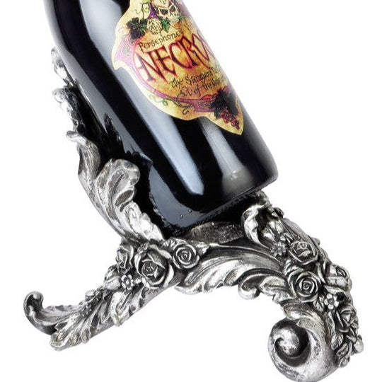 Wine bottle with decorative silver holder on a white background