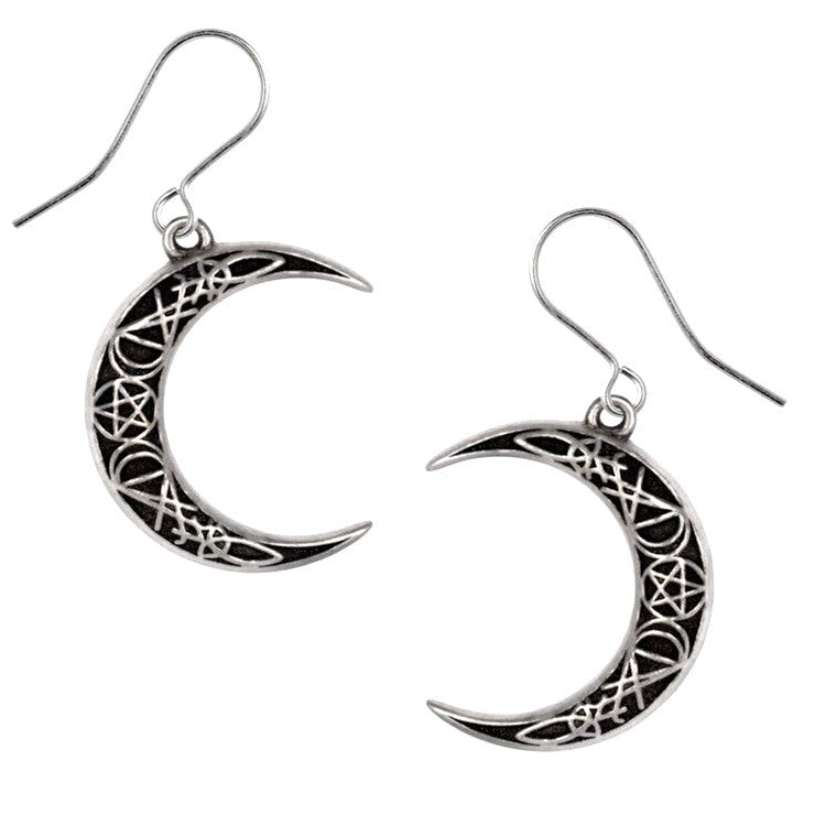Crescent moon-shaped earrings with intricate designs on a white background