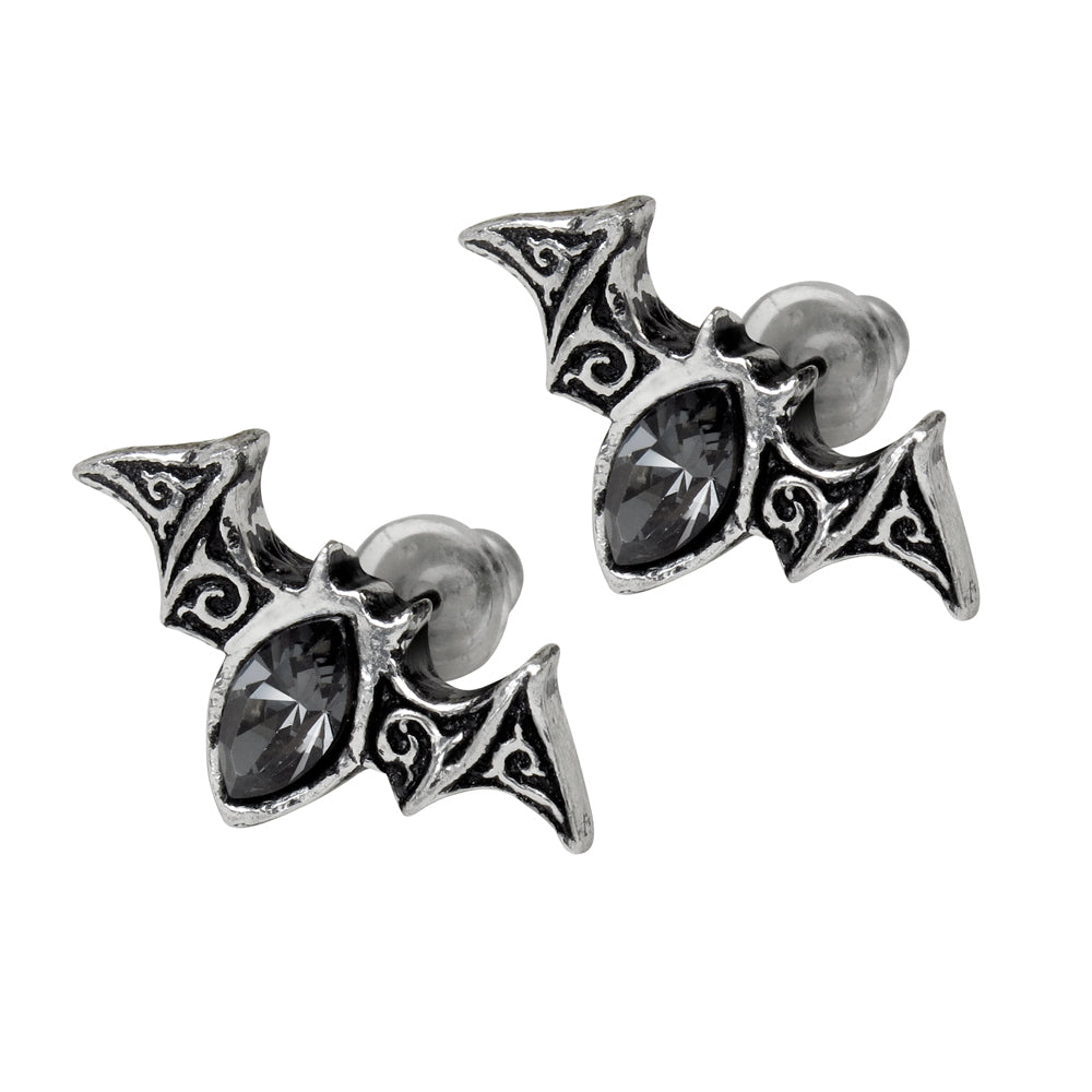 Pair of silver bat-shaped earrings with black gemstones on a white background