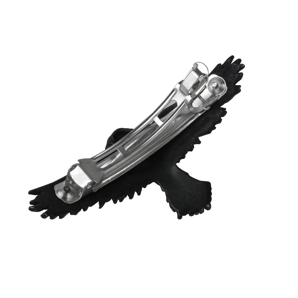 Black and silver hair clip on a white background