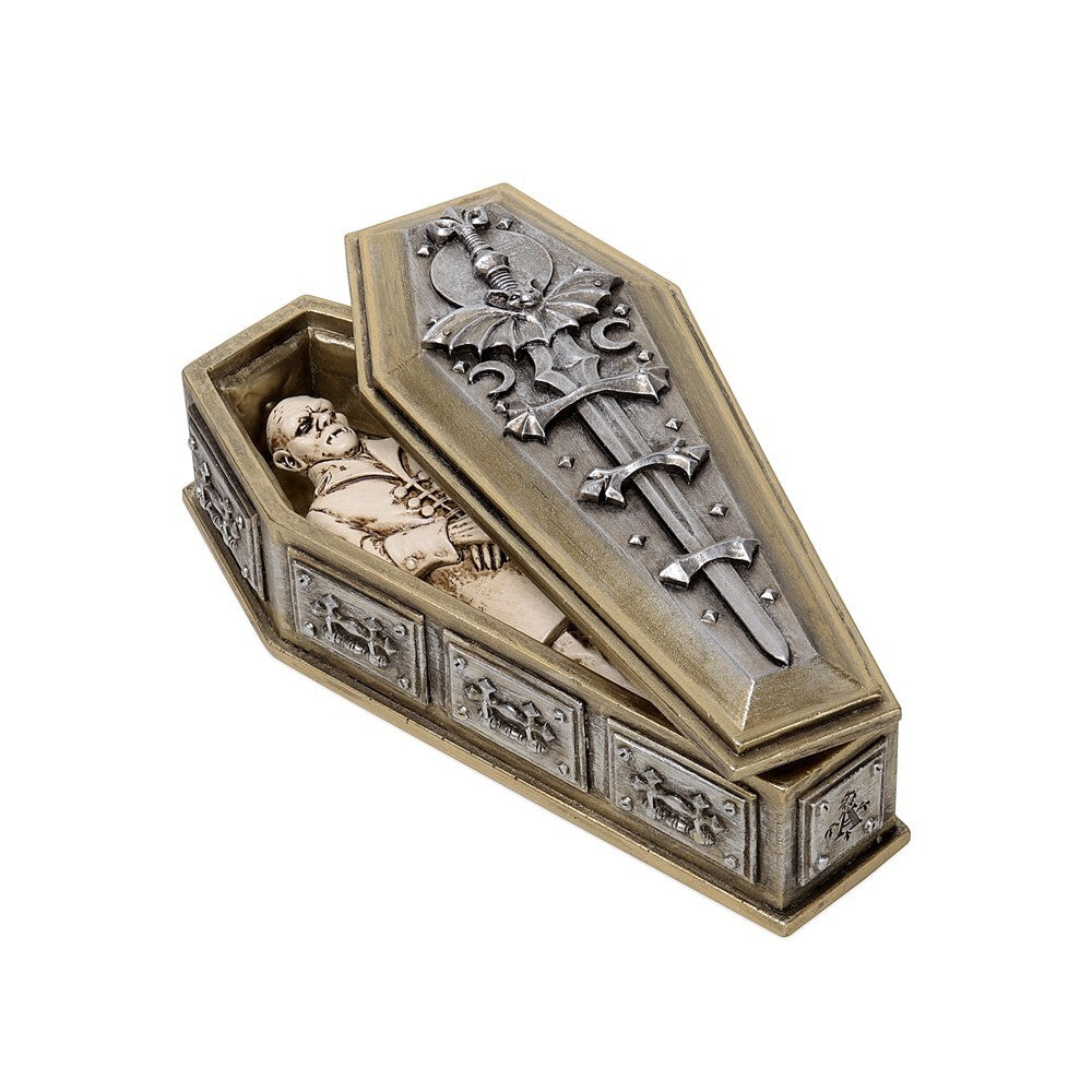 Decorative coffin with a figurine and sword on a white background