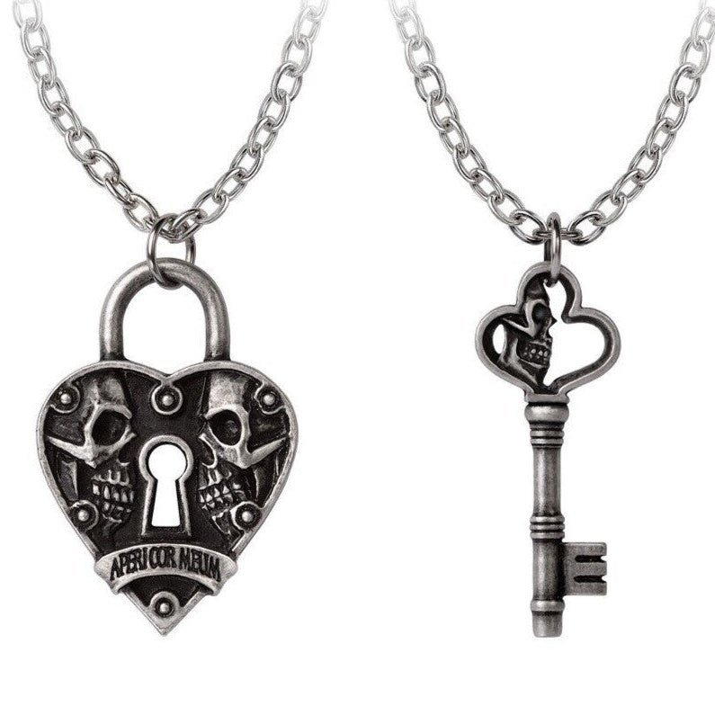 Two silver necklaces with a heart-shaped lock and key pendant on a white background.