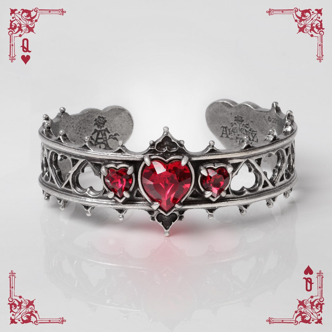 Silver bracelet with red heart stones on a white background