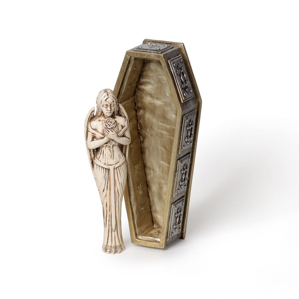 Decorative coffin with a figurine of a woman holding a rose on a white background