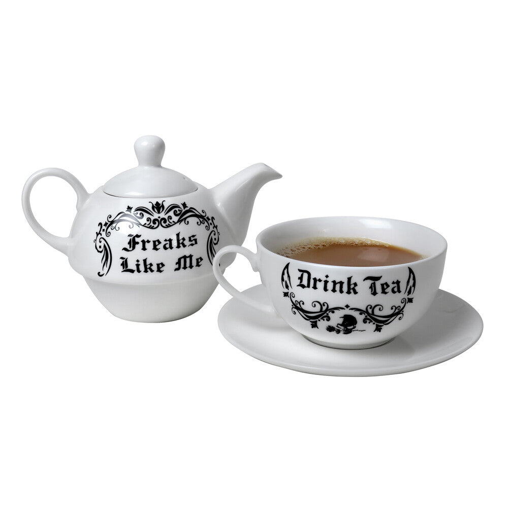 Tea set with 'Freaks Like Me' on teapot and 'I Drink Tea' on cup and saucer.