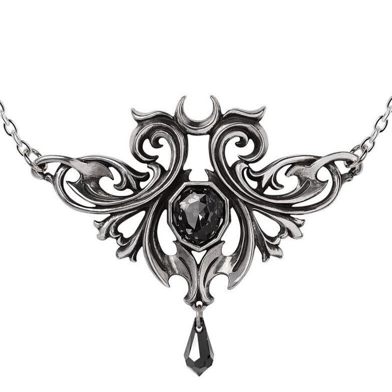 Ornate silver necklace with a central black gemstone on a white background