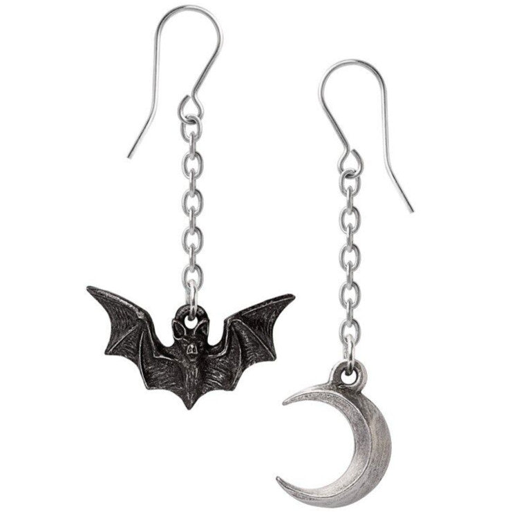 Pair of earrings with bat and moon design on a white background