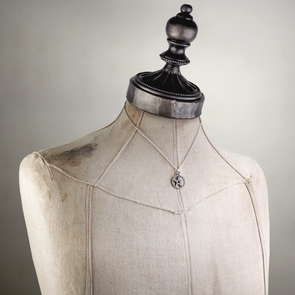 Necklace on a mannequin with a neutral background