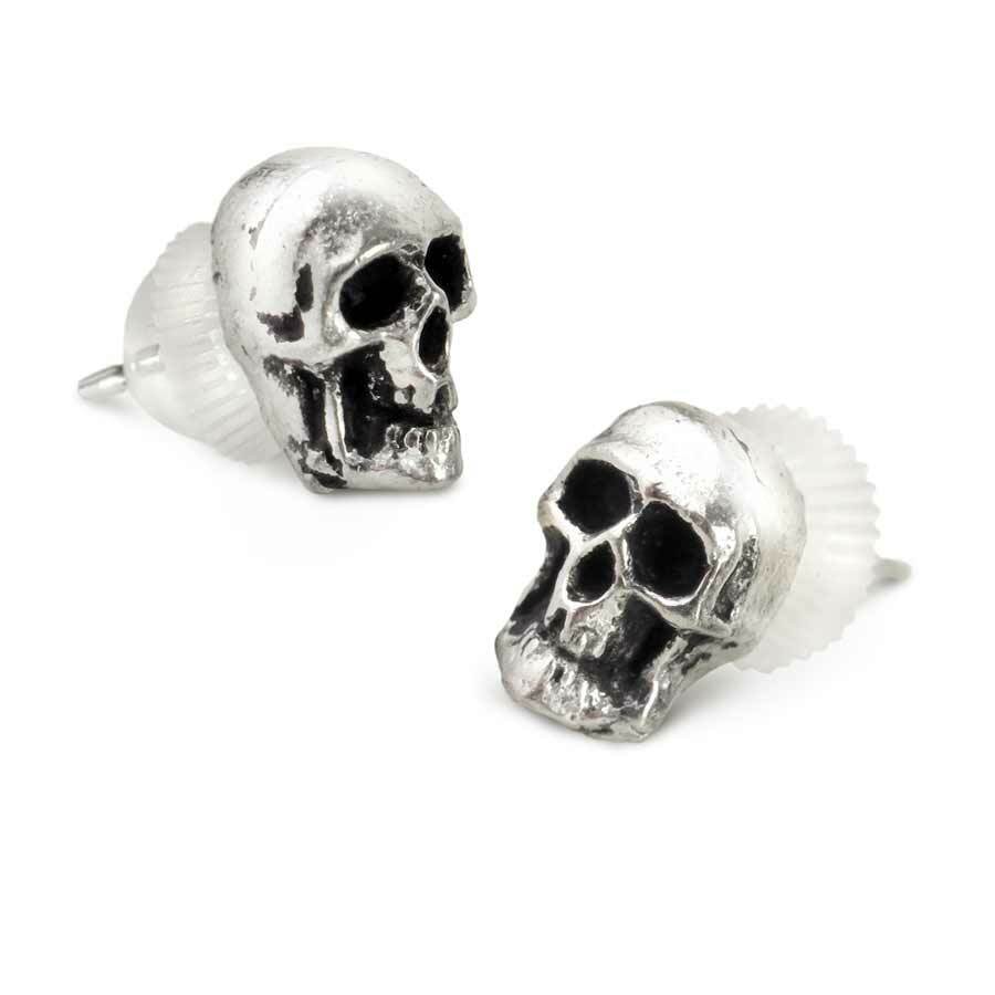 Silver skull-shaped earrings on a white background