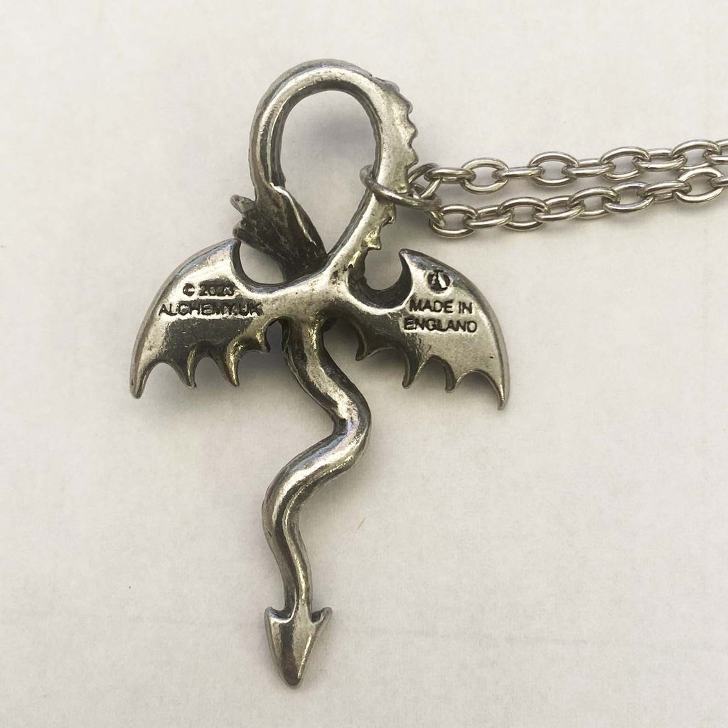 Silver dragon pendant on a chain with 'Made in England' stamp on a white background