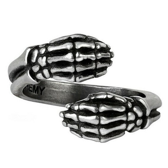 Silver skeleton hand ring on a white background