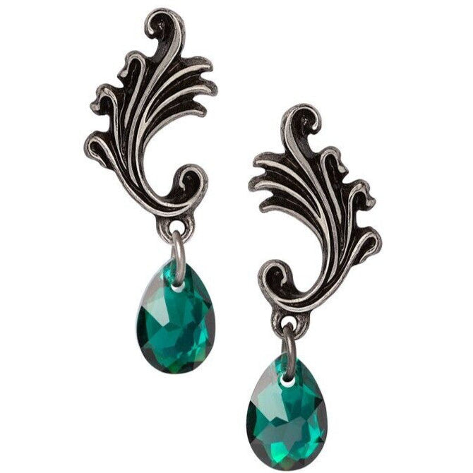 Ornate silver earrings with green teardrop stones on a white background