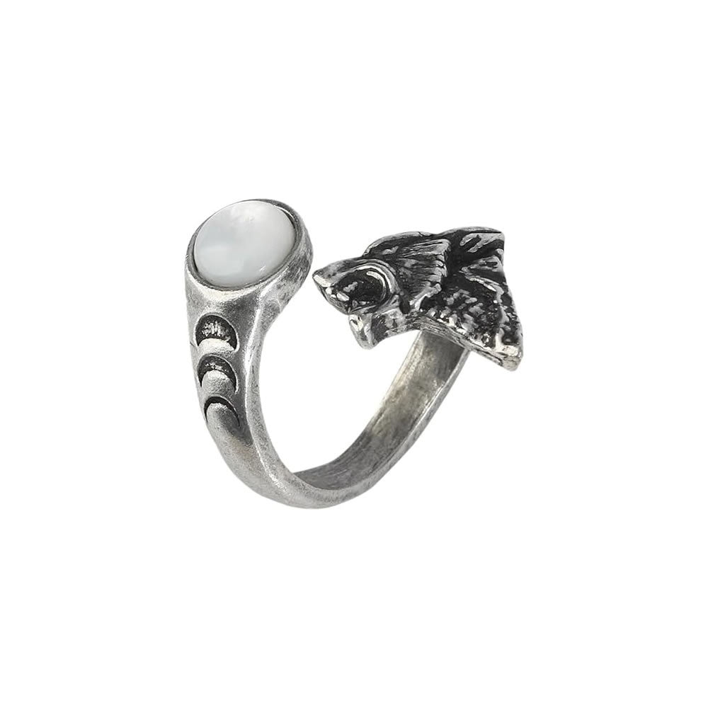 Silver ring with wolf head design and white stone on a white background