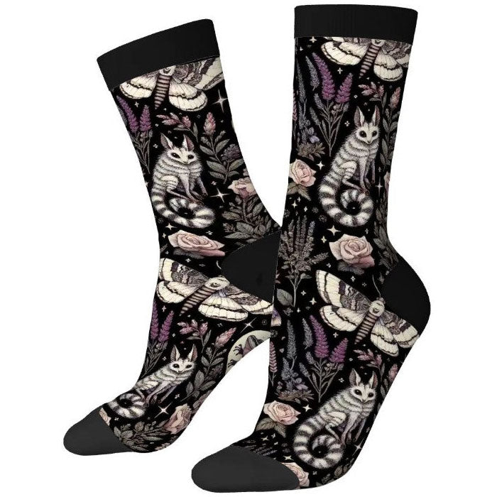 Pair of socks with cat and floral design on a white background