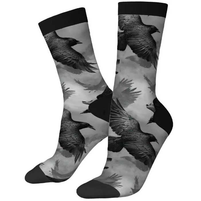 Socks with black and gray bird design on a white background
