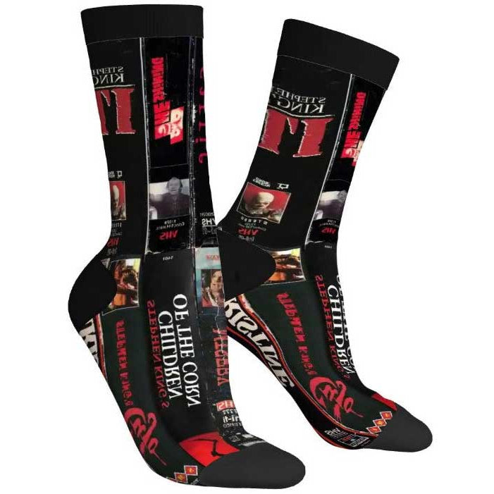 Pair of socks with Stephen King book cover designs on a white background